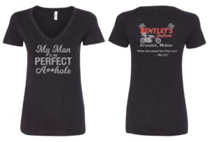 Black V-neck shirt with bold, cheeky text about a man on the front.