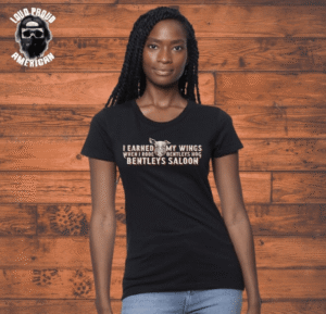 Woman wearing a black T-shirt with a humorous quote about marketing and sales.